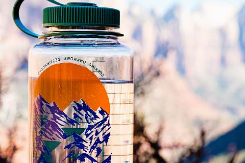 jar close up photo of clear plastic tumbler with green lid zion national park